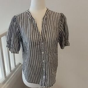 100 percent cotton button down shirt.